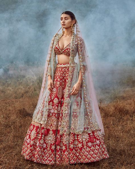 A fresher color palette, unique embroideries & newer silhouettes, are some of the reasons to fall in love with KALKI Fashion's most awaited bridal couture collection - ‘ROOH’ – a spirit pure & free. To say the least, it legit defines you & your personality! Kalki Fashion Lehenga, Red Lehenga Choli, Bridal Lehenga Designs, Raw Silk Lehenga, Floral Lehenga, Wedding Lehenga Designs, Designer Lehengas, Kalki Fashion, Bridal Lehenga Collection