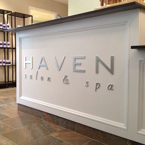 Our brushed metal logo looks right at home on our front desk... Big thanks to Summit Signs:) Hair Salon Reception Desk, Salon Front Desk, Desk Salon, Beauty Salon Reception, Salon Interior Design Ideas, Nail Salon Interior Design, Salon Reception Desk, Nail Salon Interior, Spa Reception