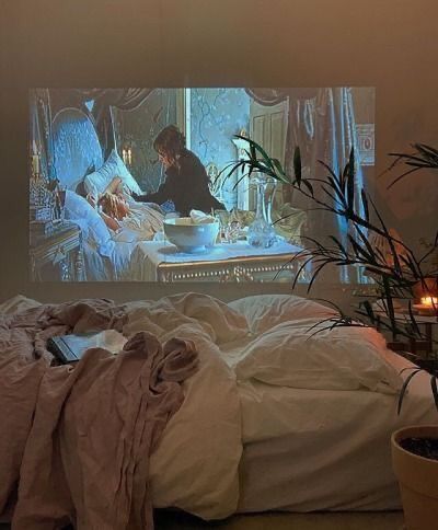 A Tv, A Woman, Candles, Tv, Bed, Plants