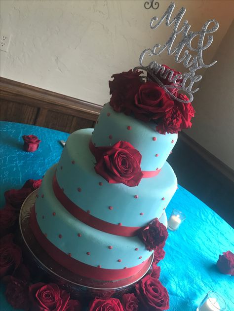 Turquoise and red wedding cake Blue Colour Cake, Teal Red Wedding, Punks In Love, Turquoise And Red Wedding, Teal And Red Wedding, Israelite Wedding, Turquoise Wedding Cake, Comic Book Themed Wedding, Blue Red Wedding