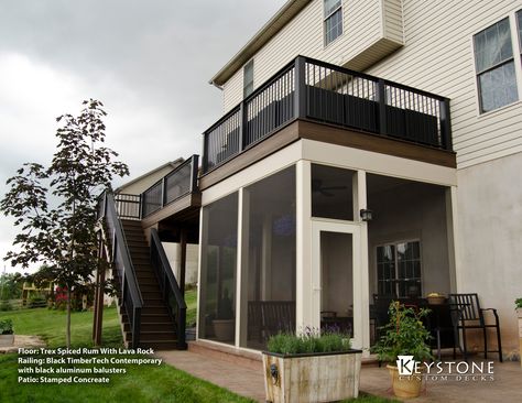 This Trex Deck was built with Trex Spiced Rum with Lava Rock Accents.This space was also constructed using TimberTech Contemporary handrails in black as well as a rain system under the deck. Under the deck a portion was finished and screened in creating a outdoor living room. The space was finished with accent lighting throughout. Deck Screened Porch, Under Deck, Building A Porch, Stamped Concrete Patio, Trex Deck, Backyard Porch, Custom Decks, Lan Can, York Pa