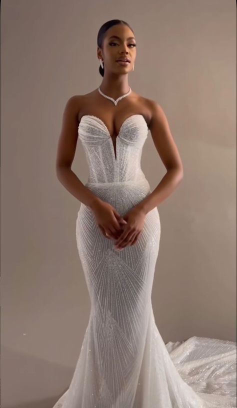 You've come to the proper place if you're getting married and you adore the thought of looking really sophisticated and slightly dreamy on your special day! These gorgeous mermaid wedding gowns are the ones we've chosen. These gowns are unique since they're made to make you appear elegant, flirtatious, and attractive. We don't Own The Rights To This Photo, Please Dm for Credit/Removal. Halter Wedding Reception Dress, Fit And Flare Wedding Dress Black Women, Enaura Wedding Dresses, Strapless Wedding Dress Black Women, Mermaid Wedding Dress Black Women, Wedding Dresses Mermaid Black Women, Bandeau Wedding Dress, Mermaid Wedding Dress Black Bride, Black Woman Wedding Dress