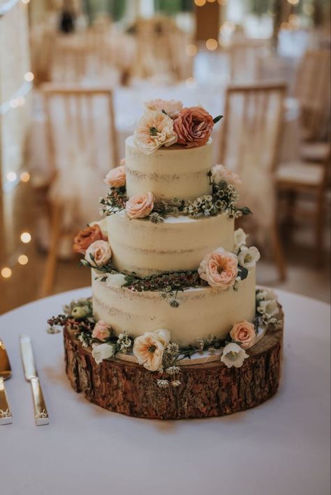 Semi naked wedding cake Exposed Wedding Cake, Rustic Engagement Cake, Rustic Floral Wedding Cake, Rustic Floral Cake, Fairy Garden Wedding Cake, Naked Wedding Cakes Rustic, Barnyard Wedding Ideas, Earthy Wedding Cake, Wedding Cake Country