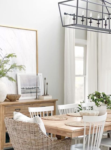 Dining room decor - coastal home - coastal style room - dining room inspo - dining furniture - rattan furniture - coastal home decor, coastal home inspiration, coastal dining room design, coastal dining room inspo, coastal home ideas, beach house decor, lake house decor, coastal vibes, coastal furniture, beach house furniture, white dining room chairs, wood dining table, coastal farmhouse dining room inspiration ideas Dining Room With Wicker Chairs, Dining Table Coastal Style, Coastal Living Dining Room Combo, Coastal Kitchen And Dining Room, White Coastal Furniture, White Kitchen Dining Table Ideas, Mid Century Coastal Dining Room, Coastal Rectangular Dining Table, Dining Room Table With White Chairs