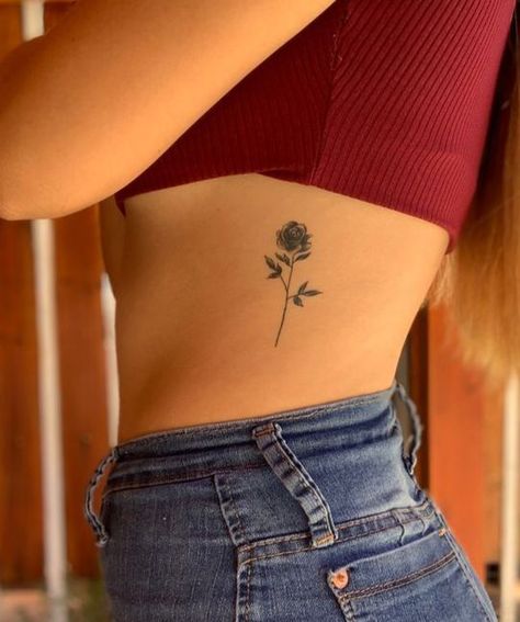 Lower Left Back Tattoos, Rose Tattoo On Side Ribs, Rose Tattoos Back, Rose Tattoo Side Rib, Rib Rose Tattoo, Rose Tattoo On Ribs, Tatuagem Percy Jackson, Tattoo Sentences, Rose Rib Tattoos