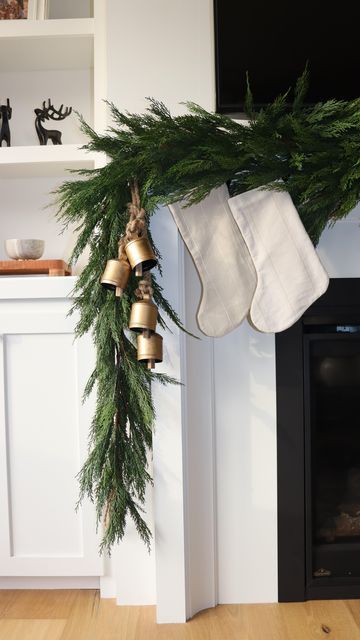 Chimney Garland Christmas, Christmas Decor Mantle Ideas, Christmas Garland On Cabinets, Bells On Mantle Christmas, Christmas Mantle Bells, Bells On Garland, Vintage Bells Christmas, Holiday Bells Decor, Garland And Stockings On Mantle