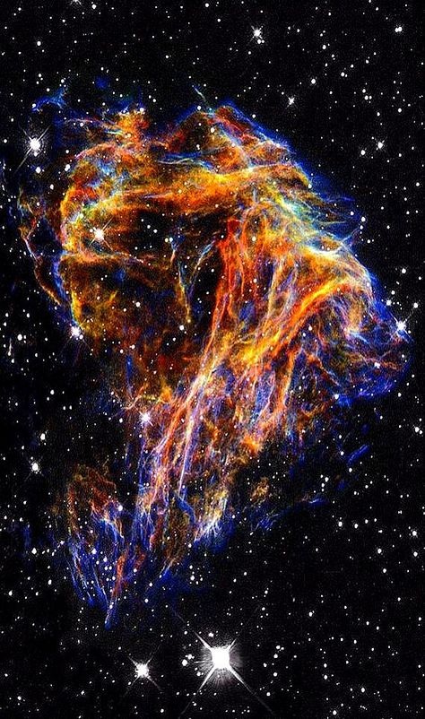 NASA’s Hubble Space Telescope, these delicate filaments are actually sheets of debris from a stellar explosion in a neighboring galaxy. Nasa Hubble Images, Background Universe, Hubble Space Telescope Pictures, Nebula Painting, Astronomy Photography, Nebula Wallpaper, Telescope Images, Nasa Hubble, Hubble Images