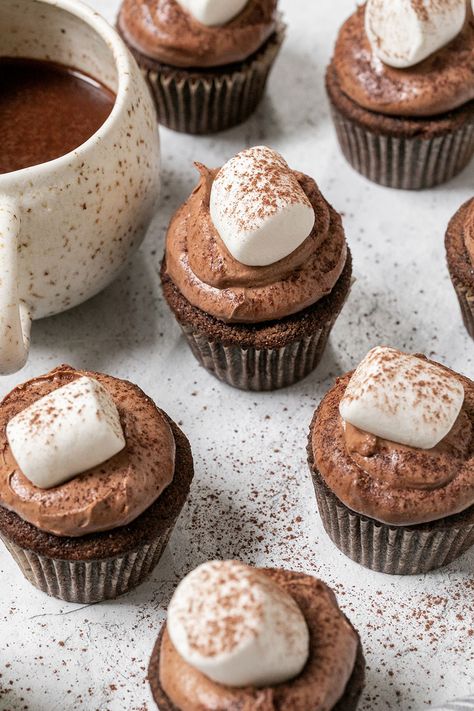 Hot chocolate cupcakes are made using actual hot chocolate, filled with homemade marshmallow fluff, and frosted with the silkiest, chocolate buttercream. The cupcakes are topped with a marshmallow and dusted with hot chocolate. #HotChocolate #HotChocolateCupcakes #Cupcakes Homemade Chocolate Cupcakes, Marshmallow Fluff Recipes, Homemade Marshmallow Fluff, Hot Chocolate Cupcakes, Chocolate Cupcakes Filled, Homemade Chocolate Frosting, Chocolate Frosting Recipes, Delicious Hot Chocolate, Carrot Cake Cupcakes