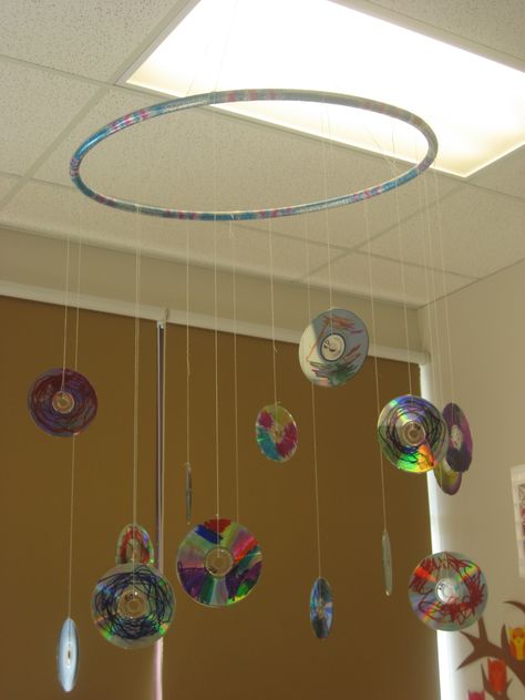 recycled cd mobile in my classroom Classroom Mobiles, Hanging Cds, Baby Room Decorations, Hang From Ceiling Decor, Nursery Hanging Decor, Recycled Cds, Paper Lanterns Diy, Cd Decor, Recycled Art Projects