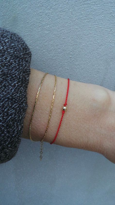 Before placing an order please check the estimated shipping times. If you need your order in a hurry shipping upgrades are available. Thank you. RED STRING OF FATE OF BRACELET D E T A I L S *Made with a pure silk cord that has been twisted for strength. Cord measures 0.7mm. *And a 18k gold filled bead at the closure. * Choose if you want the bracelet with a bead at the centre of plain. *If the silk should arrive kinked it will straighten itself out after a few hours after coming into contact wit Red String Of Fate Bracelet, String Of Fate, Red String Of Fate, Sterling Silver Heart Bracelet, Paw Print Bracelet, Arrow Bracelet, Silk Bracelet, Lovers Bracelet, Red Bracelet