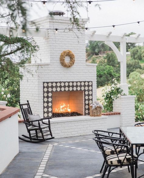 A white brick outdoor fireplace that I think we would all love to sit by tonight! 🔥 @lauraandthegs outdoor space is so cozy and welcoming.… Brick Outdoor Fireplace, Outdoor Fireplace Brick, Outdoor Fireplace Ideas, White Brick Fireplace, Exterior Fireplace, Rustic Fire Pits, Outdoor Fireplace Designs, Outdoor Fireplace Patio, Backyard Fireplace