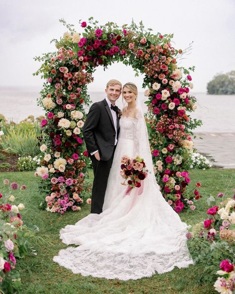 The weather did little to dampen Anna and Jake’s stunning wedding! I loved capturing all the details of the day. According to their planner, they tried to create a bold garden tea party. Their striking fall color palette was inspired by jewel tones, Anna’s love of gardening, and the couple’s time in Ireland and Boston. Deep purples balanced with light mauve and blush tones, accented with Emerald green, teal, and blueberry gave their distinct color palette complexity and texture. Refined a... Ombre Flower Arch, Jewel Tone Ceremony Arch, Jewel Tone Flower Arch, Pink Burgundy Flower Arch, Red And Pink Floral Arch, Light Mauve, Garden Tea Party, Blush Tones, Fall Color Palette