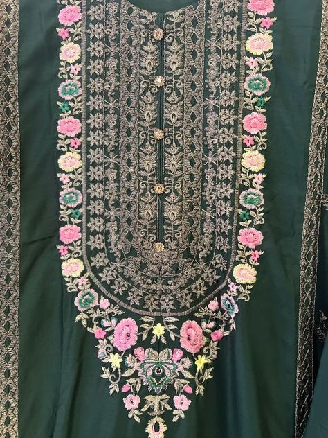 The dress shown in the image is a traditional South Asian outfit, likely intended for festive or formal occasions. Here is a detailed description of each component: ### Kurta (Tunic) - **Color**: Dark green - **Fabric**: silk - **Design**: The kurta features intricate embroidery along the neckline, sleeves, and hemline. - **Neckline**: The neckline is decorated with elaborate gold and pink floral embroidery. - **Front Panel**: The embroidery extends down the front panel, adding a rich and ... Matching Embroidery, Silk Design, Traditional Earrings, Gold And Pink, Intricate Embroidery, Asian Outfits, South Asian, Fabric Silk, Green Fabric