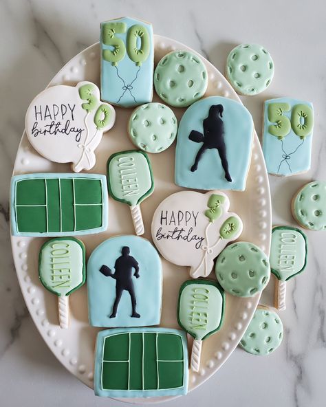 Pickleball Birthday Cookies 💙💚 Happy 50th Birthday Colleen • Decided to change my posting style a bit...I've been so busy these last 2 months, and I'm so grateful for it, but that means I can't film everything I do anymore. I'll be posting behind the scenes, though, as I go along... still have a lot to share with you 🥰 • #cookie #cookies #decoratedcookies #cookiesofinstagram #cookiehack #cookietip #cookiedecorating #satisfying #satisfyingreel #cookier #newcolors #thisweekscolors #jdsugarcooki... Pickle Ball Cookies, Pickleball Cookies Decorated, Pickleball Cookies, Pickleball Birthday, Ball Event, Sports Cookies, Ladybug Pv, Cookie Hacks, Ball Birthday