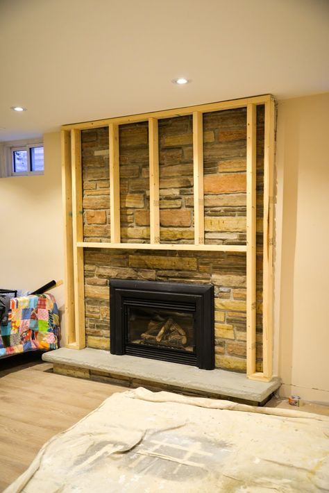 Looking for a way to update an old stone or brick fireplace? Cover your fireplace with new framing that can be covered in tile, shiplap, drywall or paint for a modern look. Update Fireplace, Brick Fireplace Remodel, Stone Fireplace Makeover, Fireplace Facing, Fireplace Redo, Fireplace Stone, Fireplace Update, Fireplace Frame, Shelves Floating