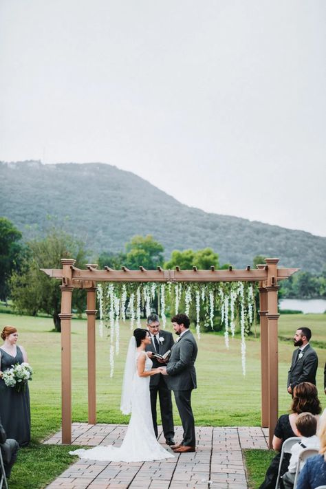 Wedding Arch With Wisteria, Wisteria Arbor Wedding, White Arbor Wedding, Wisteria Arch Wedding, Wisteria Wedding Arch, Utc Chattanooga, Wedding Arch Blue, Blue Outdoor Wedding, Dusty Blue And White Wedding