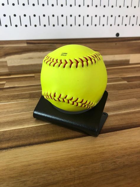 Softball displayed on metal stand. Stand is formed metal sheet to form pie shape. Round cutout in stand to hold softball Softball Display, Memorabilia Display, Trophy Case, Softball Drills, Softball Season, Softball Coach, Softball Life, Sports Marketing, Girls Softball