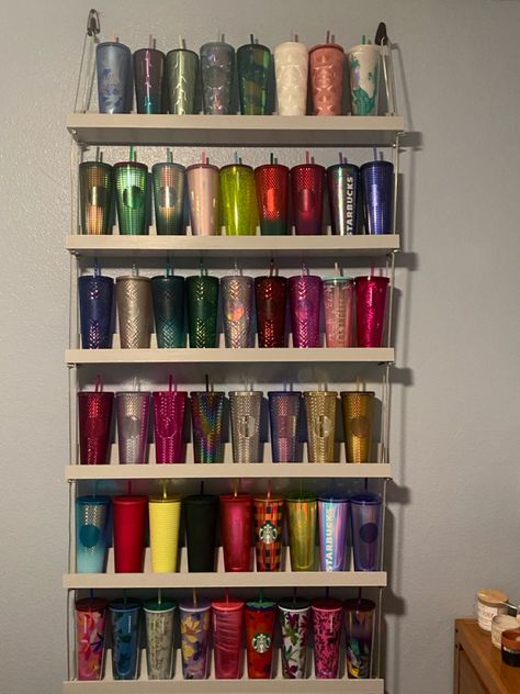 Shelves are hung with coated cable Tumblr Cup Storage Ideas, Tumbler Shelf Display, Starbucks Collection Display, Stanley Cup Organization, Cup Shelf Display, Starbux Cups, Starbucks Tumbler Collection Display, Cup Collection Display, Starbucks Cups Display