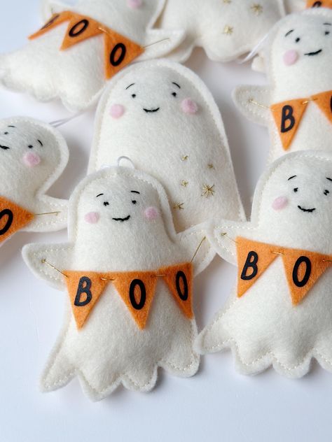 Handmade little ghost decorations have been beautifully made with 100% wool felt fabric and carefully hand stitched details . Available in two colours Ivory and Pink, also matching garland and Halloween flags available. Ghost measure Spooky Felt Crafts, Wool Felt Garland, Sewing Halloween Decorations, Felt Decorations Diy, Ghost Cushion, Felt Halloween Garland, Halloween Felt Garland, Ghost Halloween Decorations, Felt Halloween Decorations