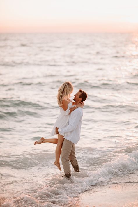 #couplesession #beachsession #floridaphotographer #floridaengagement #beachshoot #engaged #sarasotawedding #sarasotabeachwedding In Water Beach Pictures, Beach Engagement Shoot Ideas, Couples Photoshoot Poses Beach, Sunrise Beach Engagement Photos, Couples Beach Photoshoot Outfits, Couple Photoshoot Beach, Wedding Pictures Beach, Beach Engagement Pictures, Pre Wedding Praia