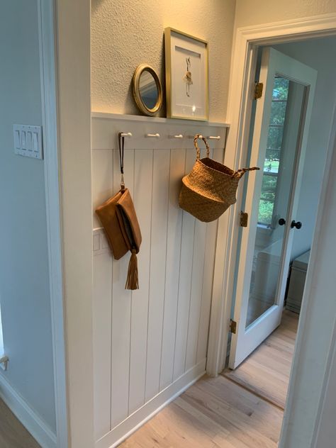 Easy project using vertical shiplap, 1*5’s and pegs. Vertical Shiplap With Peg Rail, Vertical Shiplap Board And Batten, High Traffic Wall Covering, Vertical Shiplap With Shelf, Wainscoting With Peg Rail, Hallway Panelling Tongue And Groove, Vertical Wainscoting Ideas, Vertical Shiplap Hallway, Shaker Peg Rail Entryway