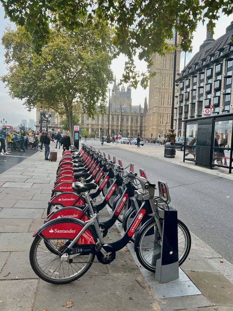 Santander Cycles (aka Boris Bikes) are a fun, healthy and sustainable way to get around London and pictured here are a bank of them near Westminster Bridge and the Palace of Westminster. This public bicycle hire scheme is managed by Transport for London and pay as you go cost £1.65 for up to 30 minutes. Photo Credit: © Ursula Petula Barzey. #BlueBadgeTouristGuide #LetsDoLondon #VisitLondon London Public Transportation, Newspaper Pictures, Cycling In London, Country Core, Palace Of Westminster, London Sights, London Vibes, Bike Pictures, Westminster Bridge