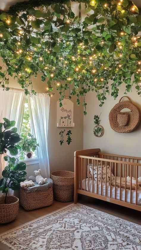 Nursery with a ceiling covered in hanging greenery and soft fairy lights, creating a forest canopy effect above a wooden crib. Woodland Fairy Nursery, Green Nursery Ideas, Nature Inspired Nursery, Canopy Ceiling, Wooden Cribs, Fairy Nursery, Dreamy Nursery, Magical Woodland, Cozy Nursery