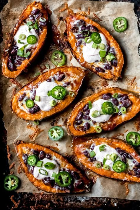 Delicious chili stuffed sweet potato skins that make the perfect game day appetizer or easy vegetarian lunch! Topped with melted cheese and a scoop of honey-lime chipotle yogurt sauce. This recipe is sponsored by BUSH’S®️️ Beans. Chili Stuffed Sweet Potato, Sweet Potato Skins Recipe, Yummy Potatoes, Meatless Dinners, Stuffed Sweet Potato, Salty Food, Salsa Yogurt, Sweet Potato Skins, Clean Eating Lunch