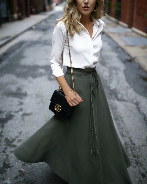 Chic Classic Outfits  // long-sleeve white blouse, olive green wrap skirt, black shoulder bag, nude lip { Gucci, winter style, work outfits, professional style, ootd} Mary Orton, Olive Skirt, Staple Tops, Professional Work Outfit, Walking Down The Street, Midi Skirt Outfit, Green Wrap, White Long Sleeve Blouse, Professional Fashion