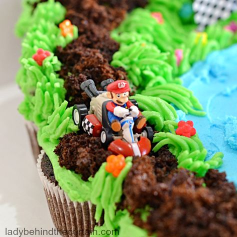 Mario Kart Cupcake Pull Apart Nintendo Switch Pull Apart Cupcakes, Mario Kart Desserts, Go Kart Cupcakes, Mario Birthday Cupcake Cake, Super Mario Pull Apart Cupcake Cake, Mario Race Track Cake, Mario Pull Apart Cupcakes, Super Mario Cupcake Cake, Super Mario Bros Cupcakes