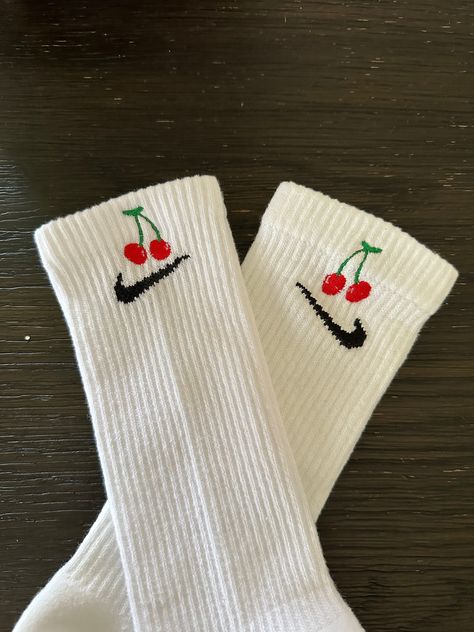 cherry socks with cherries paired together. These cute socks are trendy with medium size bright red strawberries with yellow speckles. The cherry embroidery is cute design that makes a pop of color statement. Imagine a cherry field on top of your crew socks, spring/summer vibes whenever you wear a pair.  SIZE M (6-10 WOMEN, 6-8 MEN) L ( 10-13 WOMEN, 9-12 MEN) The design is embroidered on the outer side of each sock. NOT on both sides of 1 sock. If you want it on both, please reach out and will r Cherry Accessories, Cherry Stuff, Cherry Socks, Christmas Sweatshirt Ideas, Aesthetic Socks, Cherry Embroidery, Embroidery Cute, Socks Nike, Cherry Cherry