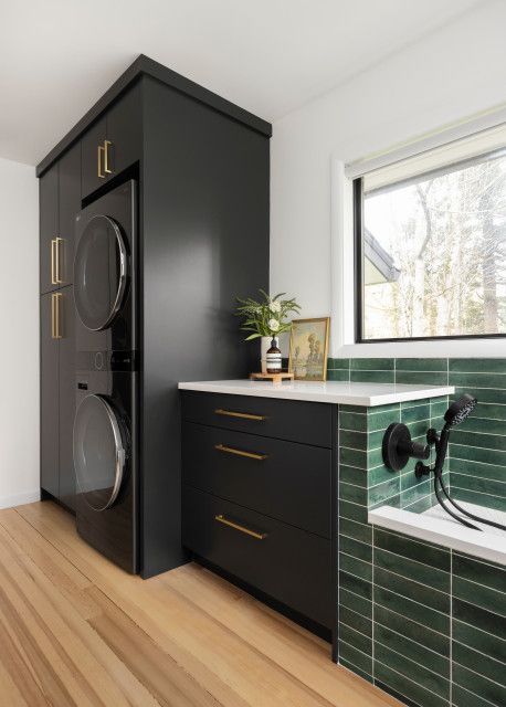 8 Impressive New Laundry Rooms Washer Dryer Laundry Room, Stackable Laundry, Contemporary Laundry Room, Stacked Laundry Room, House Mediterranean, Cleaning Cabinets, Stylish Laundry Room, Basement Laundry Room, Stackable Washer And Dryer