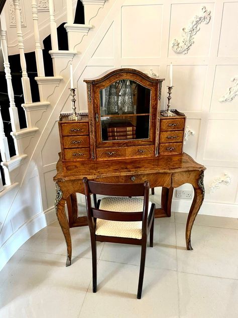 Outstanding quality antique Victorian burr walnut Bonheur de Jour writing desk having a beautifully designed and shaped top glazed cabinet to the centre which opens to reveal a fitted mirror and shelf interior with elegant ormolu mounts to the sides, one long burr walnut drawer below with attractive tulipwood crossbanding and flanked by tulipwood crossbanded burr walnut drawers with pretty original brass gilded handles and galleries. The base boasts a magnificent burr walnut inlaid shaped top wi 1890s Decor, Dark Oak Desk, Victorian Writing Desk, Victorian Desk, Vintage Desks, Walnut Mirror, Desk Cabinet, Pedestal Desk, Dream Furniture