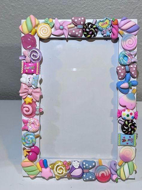 This is a sweet candy Picture frame. I have completely covered the front in all types of different embellishment charm candies and it couldn't have came out cuter!!  I will offer this in black or white frame and different size variations!  4x6 frame pictured Polymer Clay Picture Frame, Decorate Picture Frames, Cadre Photo Diy, Diy Crafts Easy At Home, Candy Pictures, Photo Frame Crafts, Charms Candy, Girly Frame, Bee Creative