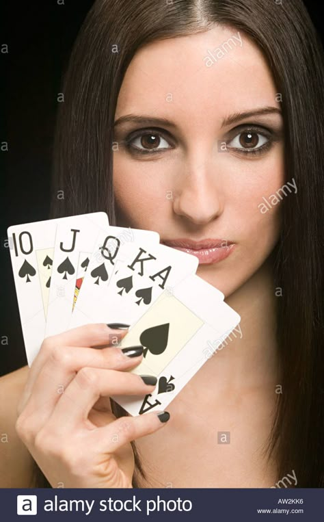 Woman holding playing cards Stock Photo Hand Holding Deck Of Cards Drawing, Shuffling Cards Pose Reference, Person Holding Cards Reference, Card Holding Pose, Holding Cards Pose Reference, Holding Cards Reference, Hands Holding Cards, Hand Holding Playing Cards, Gentlemen Guide