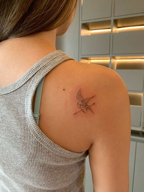 Simple Hunger Games Tattoos, Mocking Jay Tattoos, Hunger Games Inspired Tattoo, Tattoo Ideas Hunger Games, Simple Movie Tattoos, Subtle Hunger Games Tattoos, Katniss Tattoo, Ballad Of Songbirds And Snakes Tattoo, Mockingjay Tattoo