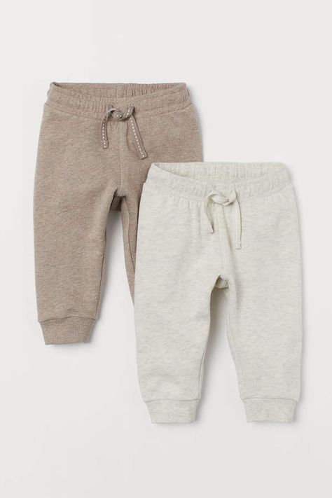 H&M - 2-pack Cotton Joggers - Beige Storing Baby Clothes, Baby Mode, Baby Club, Neutral Baby Clothes, Trendy Baby Clothes, Fashionable Baby Clothes, Sweatshirt Fabric, Gender Neutral Baby Clothes, Baby Boy Fashion