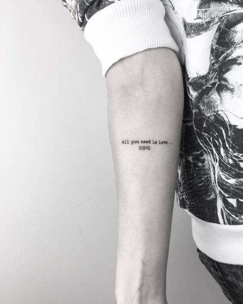 The famous quote ‘all you need is love’ inked on the right inner forearm Movie Quote Tattoos, Simple Quote Tattoos, Christian Sleeve Tattoo, Movie Tattoos, Shape Tattoo, Back Of Shoulder Tattoo, Disney Tattoo, Tattoo Font, Tattoo Videos