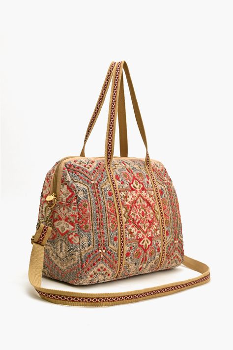 Indulge in the allure of intricate tapestry design, each thread carefully placed by skilled hands to create a visual symphony of opulence. The hand-embroidered details add depth and dimension, making every inch of this Royal Tapestry Duffel Bag a canvas of artistry. Each piece is a testament to the dedication of our artisans. Thoughtfully designed to accommodate your daily essentials without compromising on style. This weekender can be used as a Tote , Crossbody or A duffle for a stylish getaway Luxury Embroidered Travel Shoulder Bag, Luxury Embroidered Travel Bags, Embroidered Multicolor Travel Bag, Embroidered Tapestry Travel Bag, Elegant Tapestry Tote Bag, Tapestry Bag, Embroidered Details, Strap Top, Wedding Bag