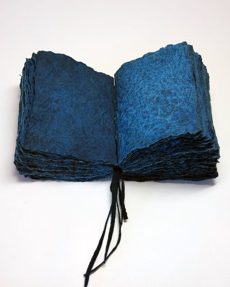 Handmade flax paper with indigo dye, konn’yaku paste, and momigami kneaded effect intended to give the look and feel of fabric. Simple all-along stitch over indigo dyed tapes. All cover papers handmade and hand-dyed by the artist. Momigami Projects, Momigami Paper Art, Artist Books Handmade, Handmade Book Covers, Dye Paper, Book Cover Ideas, Personalized Sketchbook, Indigo Dyeing, Coptic Stitch