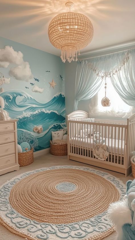 Coastal-inspired nursery with ocean mural, woven pendant light, and sea-themed decor in soothing blue and beige tones. Chic Nursery Ideas, Ocean Nursery Girl, Sea Kids Room, Ocean Baby Rooms, Sea Nursery Theme, Gender Neutral Nursery Colors, Neutral Nurseries, Ocean Themed Nursery, Boy Nursery Themes