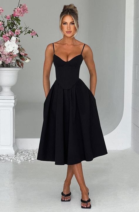 Make an entrance in Mariella, the party midi of your dreams this season. Super feminine and chic, this black dress is truly an icon with a structured, corseted bodice that's boned to cinch your waist and contrasted by a full, voluminous skirt. Formal A-line Midi Dress With Boned Bodice, Evening Midi Dress With Voluminous A-line Skirt, Elegant A-line Corset Dress With Boned Bodice, Ruched A-line Midi Dress For Cocktail, Elegant Party Midi Dress With Boned Bodice, Chic A-line Corset Dress With Lined Bodice, Chic Midi Dress With Boned Bodice For Gala, A-line Dress With Ruched Bodice For Night Out, A-line Midi Dress With Pleated Bodice For Date Night