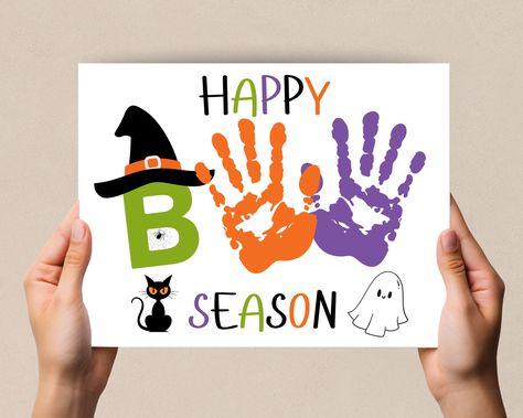 Halloween Handprint Art, Handprint craft, Happy Boo Season Printable. Perfect daycare or preschool activity. This cute design for  Halloween is a fun preschool craft. This Handprint art is designed to bring creativity to your home, daycare, or craft time. Whether you're a parent or teacher these charming handprint designs will make your creative time special and personalized.  What's Included:  High-Resolution PDF Files: File is design in high-resolution PDF format, ensuring crisp and vibrant pr Handprint Art September, Seasons Craft For Preschool, Toddler Halloween Crafts Hand Prints, Fall Arts And Crafts For Kids Toddlers, Toddler Halloween Handprint Crafts, Daycare Halloween Activities, Toddler Pet Crafts, Handprint Halloween Art, Handprint Halloween Crafts