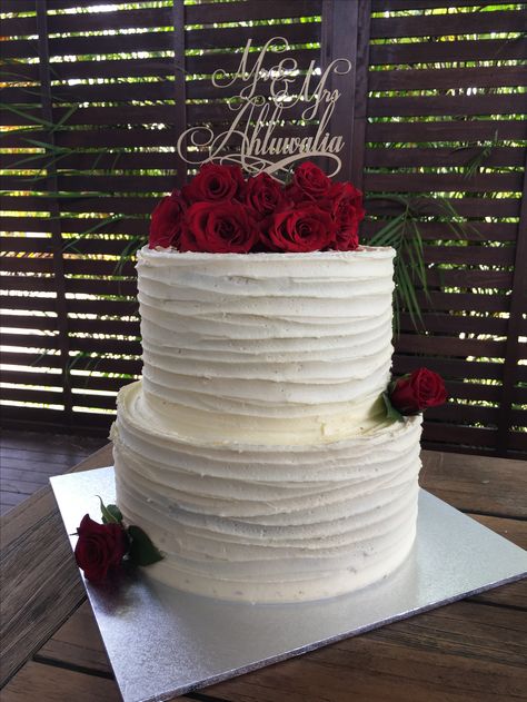 Two tier vanilla buttercream cake with fresh red roses and personalized cake topper Two Tier Quinceanera Cake, Real Roses On Cake, Wedding Cake With Roses 2 Tier, White Cake Red Roses, White And Red Birthday Cake, Cake With Roses On Top, Red And White Cake, Vanilla Buttercream Cake, Wedding Cake Icing