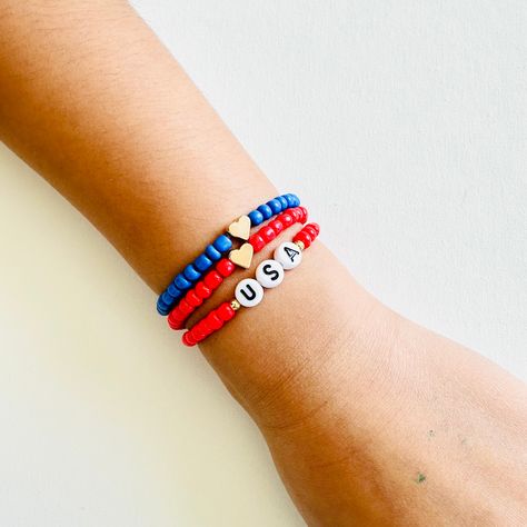 Celebrate Independence Day in style with our 4th of July bracelets, sold individually to suit your personal preference. Choose between gold or silver accents to match your style. 4th Of July Bracelets, Usa Independence Day, Blue Beaded Bracelets, Alphabet Beads, Bracelet Ideas, Silver Accents, Clay Beads, How To Make Beads, Red White And Blue