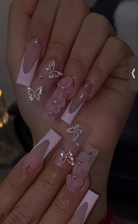 Pink French Tip Nails With Butterflies, Nail Ideas 3d Flowers Pink, 3d Flower And Butterfly Nails, Pink French Tip Nails With 3d Flower, Acrylic Nail Butterfly Designs, Nail Inspo With Butterflies, Quinceanera Nails Butterfly, Pink Quince Nails With Butterflies, Pink Rose Gold Quince Nails