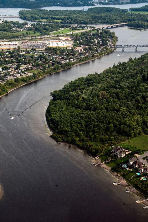 The flow of cities Between #Gatineau and #Ottawa. . . . . . . #river #aerial #river #fleuve #boat #vegetation #forest #green #city #bridges Ottawa River, Factory Building, Green City, Ottawa, The River, Forest Green, Forest, Water, Green