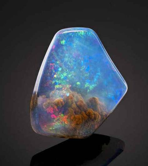 This is an American Contra Luz Opal. | This Beautiful Gemstone Looks Like It Contains A Small Nebula Luz Opal, Pretty Rocks, Beautiful Rocks, Mineral Stone, Rocks And Gems, Minerals And Gemstones, Precious Gems, Gems And Minerals, Stone Rocks