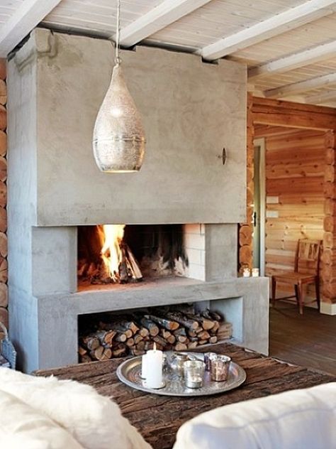 I like the wood storage underneath the hearth for the outdoor fireplace. Faux Concrete Wall, Design Camino, Wood And Concrete, Concrete Fireplace, Mountain Cottage, Firewood Storage, Fireplace Hearth, Rolling Cart, Home Fireplace