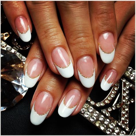 Looking for a classy and luxurious way to show your love for gold? Try gold french tips nails! With their sleek design and shiny finish, these nails will make you look and feel like a million bucks. French Tip With Gold Glitter Line, French Manicure Gold Line, Gold Line French Tip, White French Tip Nails With Gold Line, Gold Lined French Tip Nails, Gold Lined French Tips, White French Tips With Gold Line, French Manicure With Gold Line, Good French Tip Nails